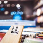 Explore a retro music store with vintage Beatles vinyl records on display.