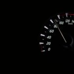 Speedometer reading showing speed in km/h on a dark background.