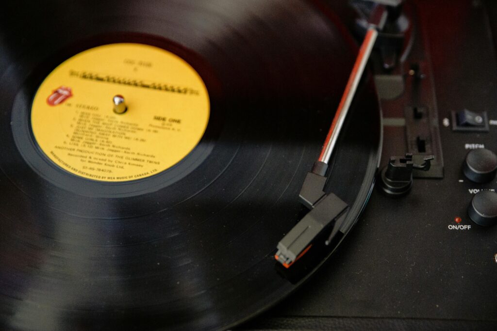 Close-up of a vinyl record spinning on a turntable, capturing a retro vibe.