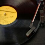 Close-up of a vinyl record spinning on a turntable, capturing a retro vibe.
