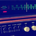 A retro FM-AM stereo tuner with knobs and wooden accents, embodying vintage audio equipment.