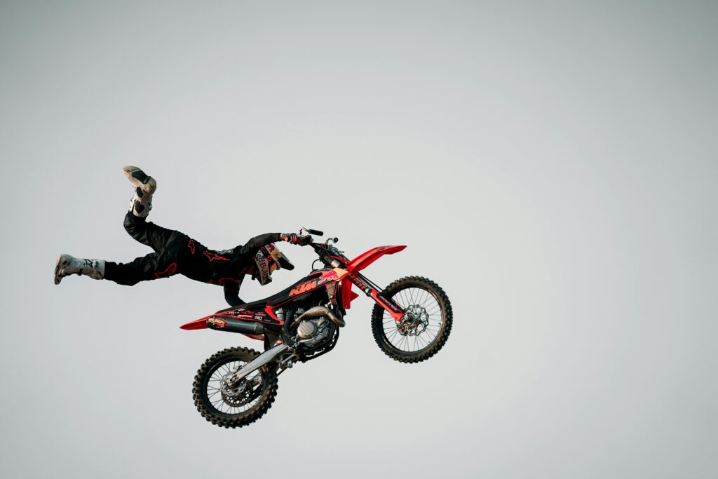 Dynamic capture of a motorcyclist performing an extreme stunt in the air.