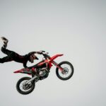 Dynamic capture of a motorcyclist performing an extreme stunt in the air.